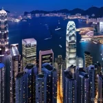 Home 8 홍콩과 마카오의 역사적 차이 - **Prompt 1: Hong Kong's Vertical Energy**
A panoramic view of Hong Kong's Central district at tw...